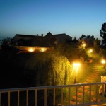 28 SALGADINHO - Lower garden area and BBQ at night seen from the panorama terrace