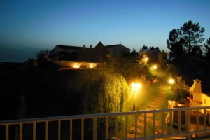 28 SALGADINHO - Lower garden area and BBQ at night seen from the panorama terrace